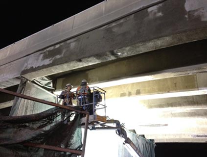 HWY 401 and HWY 62 Underpass Rehabilitation - Vertical and overhead shotcrete application at bridge girder element.